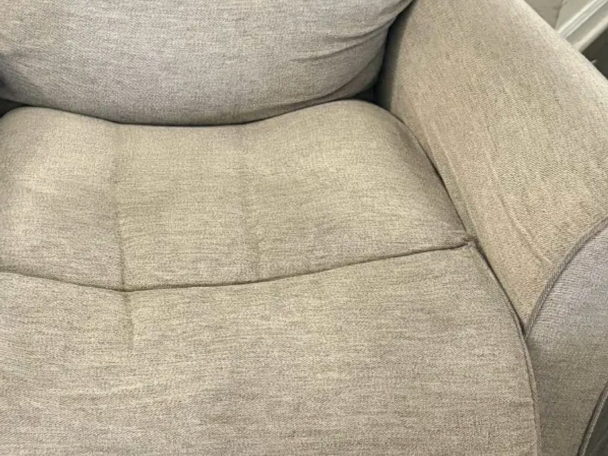 Seat and rolled arm of a chenille recliner after cleaning, the texture clean where hands and heads rest